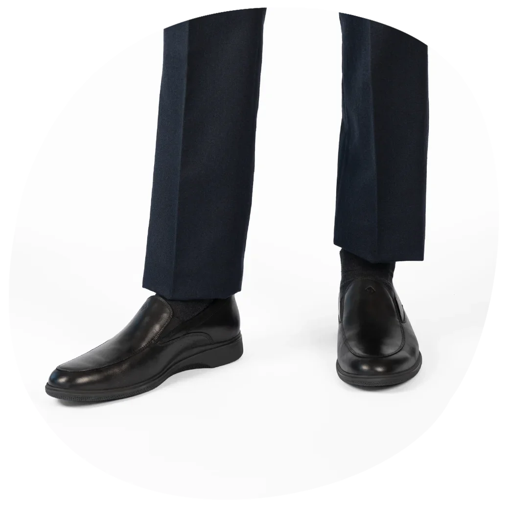 The Slip-On by Amberjack in Obsidian Leather - Worn with Navy Dress Pants