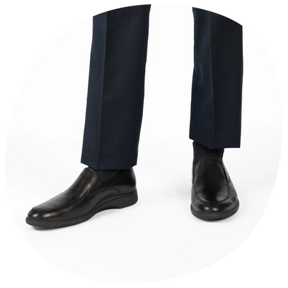 The Slip-On by Amberjack in Obsidian Leather - Worn with Navy Dress Pants